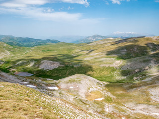 Fototapeta na wymiar glacial lake on the mountains of Roccaraso in summer,(plateau) Piano Aremogna and Pizzalto, Monti Marsicani, Apennines, L'Aquila, Abruzzo, Italy
