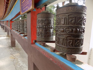 Fototapeta na wymiar Buddhist prayer wheel at Buddhist temple.