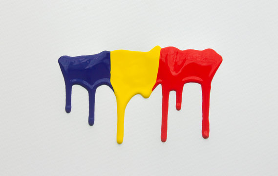 Primary colored  drip on a white surface