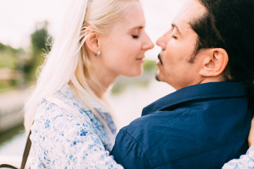 Beautiful loving couple outdoor activity. Italian man with his caucasian girlfriend emotional relationships.