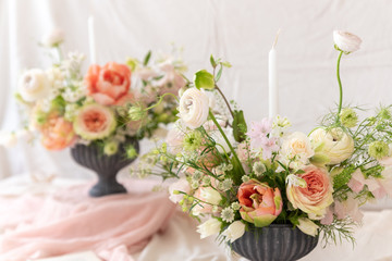 Still life with  beautiful bouquets of flowers and candles