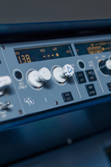 Toggle switches and sensors on the dashboard in the cabin of passenger plane