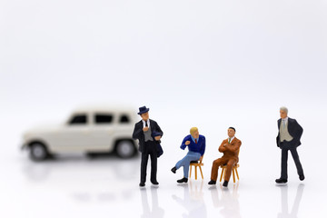 miniature people: Business consultants on financial transactions for car loan . Image use for financial, business concept.