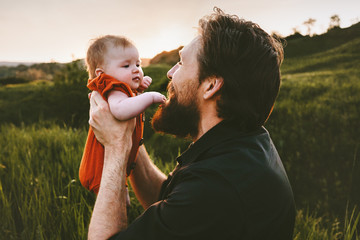 Father with baby outdoor happy family lifestyle Fathers day holiday dad and infant child walking...
