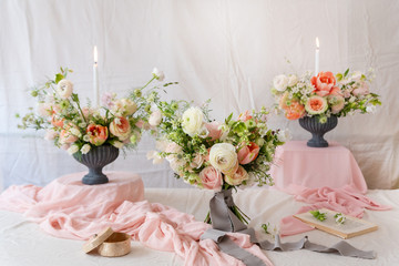 Still life with  beautiful bouquets of flowers and candles
