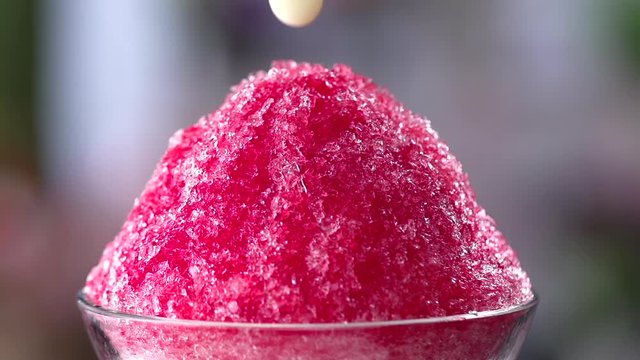 pouring Condensed milk into shaved ice, Slow motion shot