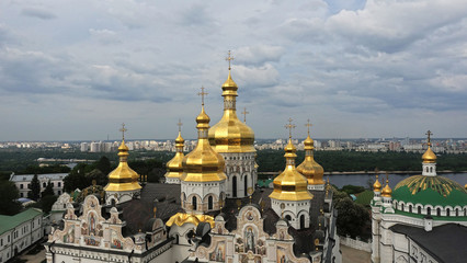 Fototapeta na wymiar Golden domes of the Assumption Cathedral of Kiev-Pechersk Lavra over the Dnieper