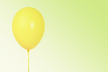 Yellow Ballon on yellow on gradient pastel background