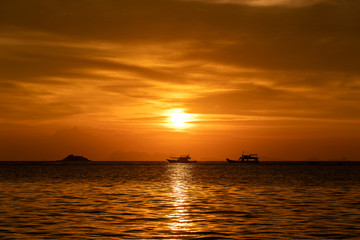 Naklejka na ściany i meble Colorful sunset above the sea. Summer vacation concept. Thailand