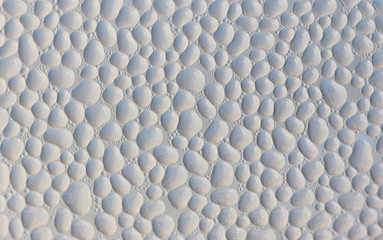 Fototapeta premium Drops of condensate on the surface of a plastic bottle, close-up