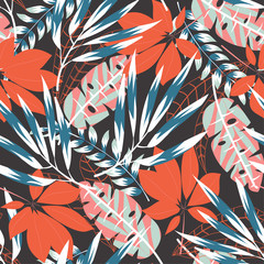 Seamless pattern with bright tropical leaves and plants on a delicate dark brown background. Vector design. Jungle print. Floral background. Printing and textiles. Exotic tropics. Summer design.