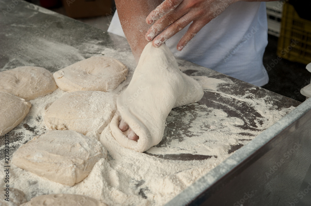 Wall mural preparing pizza margherita dough on a countertop.