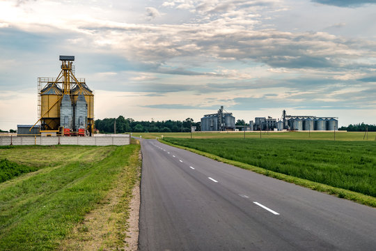 agro-processing plant for processing and silos for drying cleaning and storage of agricultural products, flour, cereals and grain with beautiful clouds