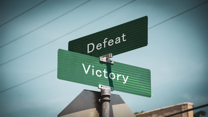 Street Sign Victory versus Defeat