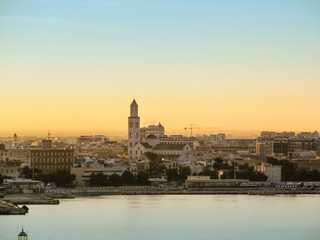 Obraz na płótnie Canvas Cityscape of Bari, Puglia, Italy. November 23, 2012. Panorama of port and city at morning dawn. 