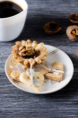 Homemade baking. Shortcake dough baskets with walnuts and condensed milk.