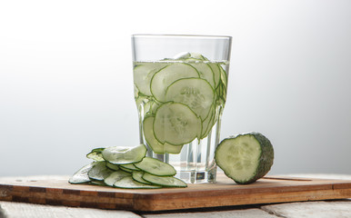 Cucumber water, cleansing water to detoxify the body and quench thirst on a white background.