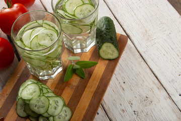 Cucumber water, cleansing water to detoxify the body and quench thirst on a white background.