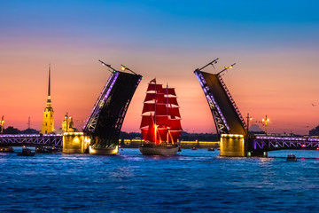 Fototapeta na wymiar Saint Petersburg. Holiday Scarlet Sails. Russia. Evening Petersburg. Sailboat sailing on the Neva River. Holidays in the Russian Federation. Sailboat with scarlet sails. Summer evening.