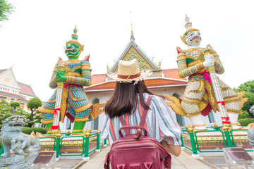 Fototapeta premium Asian backpack tourost women travel in temple of buddism