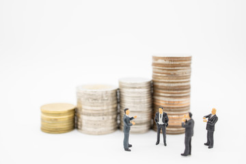 Business, Finance, Saving and teamwork concept. Close up of group of businessman minature figures...