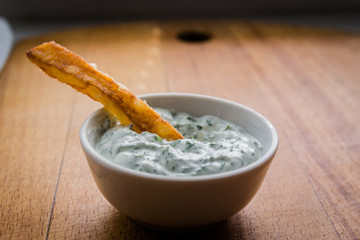 fried potatoes and garlic sauce in the kitchen