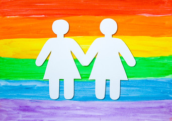 girls of paper against the rainbow LGBT