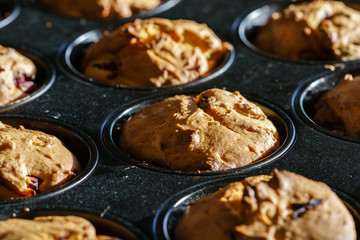 Freshly baked vegan vanilla-chocolate and cherry muffins