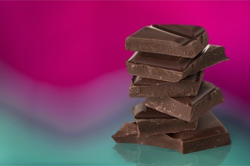 Milk dark chocolate stack on gradient pastel background