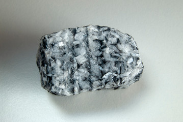 Macro shooting of a natural mineral from a geological collection - piece magnesite mineral stone,...