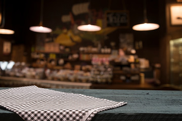 Table background with napkin and blurred bar background space