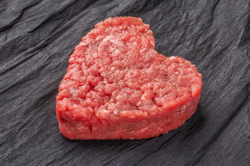 Beautiful juicy meat cutlet on a contrasting black background