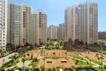 Obraz premium Aerial view playground workout place and house building exterior mixed-use urban multi-family community residential district area development