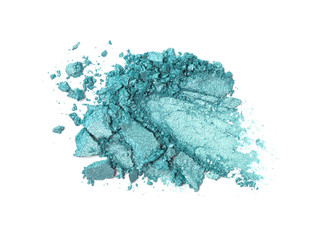A broken turquoise gradient colored eye shadows isolated on a white background. Top view, flat lay. Copy space for your text