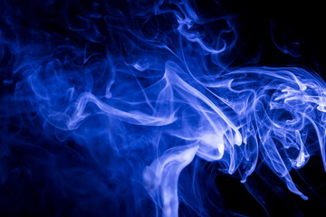 Blue smoke on black background