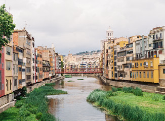 A bridge and colorful buildings in Girona, Spain