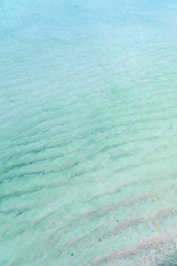 Fototapeta na wymiar Colorful sand on tropical beach. Copy space.
