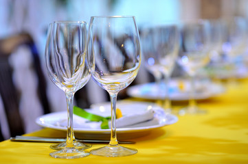 Empty transparent glasses on a festive table