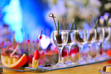 The beautiful decoration of the festive table for guests with flowers