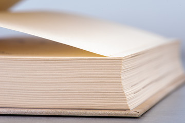 Opened book on table macro