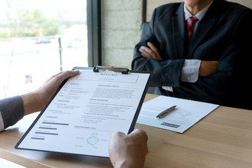 Job interview with corporate business manager arms folded