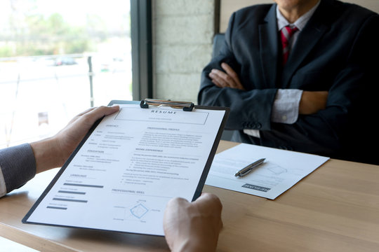 Job interview with corporate business manager arms folded