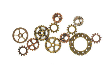 Gears bronze and copper shades of different diameters and type on a white background...