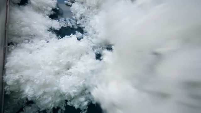 Synthetic filling moves on a conveyor at a nonwoven fabric plant.