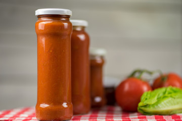 glass canned tomatoes with white background