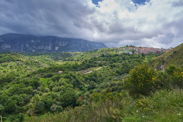 Fototapeta na wymiar Landscape Picture of beautiful small mediaeval town or village Isnello to be located in Madonie mountain range in Italy in Palermo Province of island Sicily. Picture is taken in cloudy spring day.