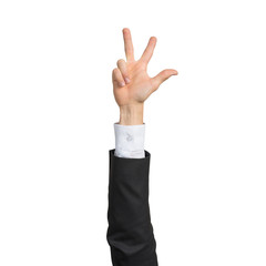 Businessman hand in suit showing rock gesture