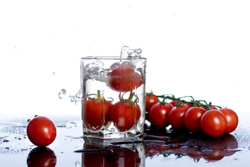Tomatoes in a transparent glass