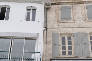 Rustic French building facade white wall and stone facades