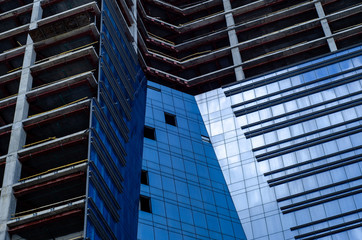 Fototapeta na wymiar Close-up of skyscraper building under construction.